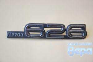 Эмблема Mazda 626 (перед) п-50